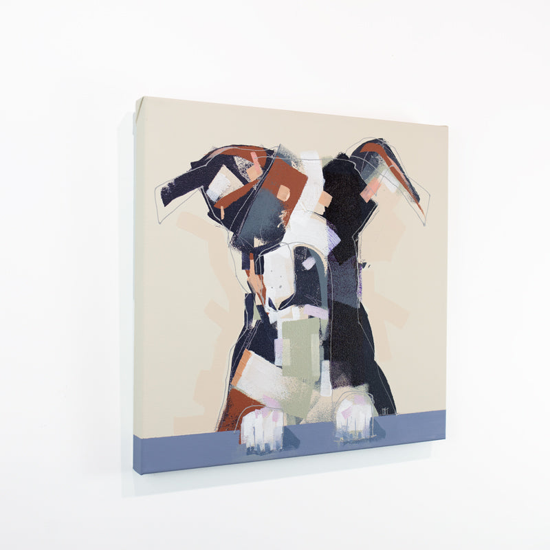 An abstracted painting of a dog hangs on a white wall.