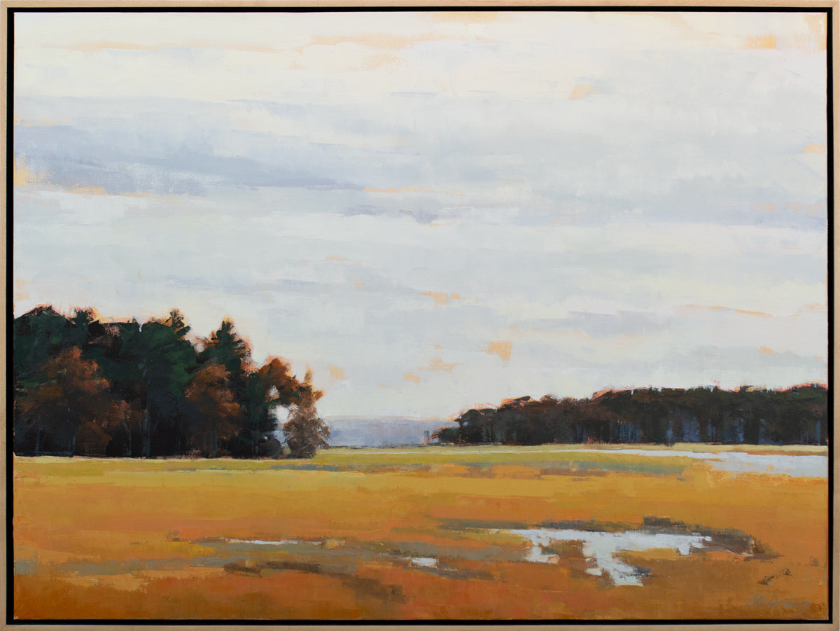 A light blue, dark green and shades of orange abstract landscape painting by Molly Doe Wensberg in a light wood floater frame.