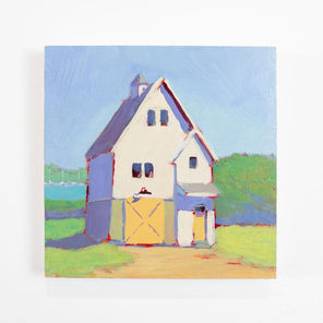 A green, blue, violet, and yellow painting of a house hangs on a white wall. 