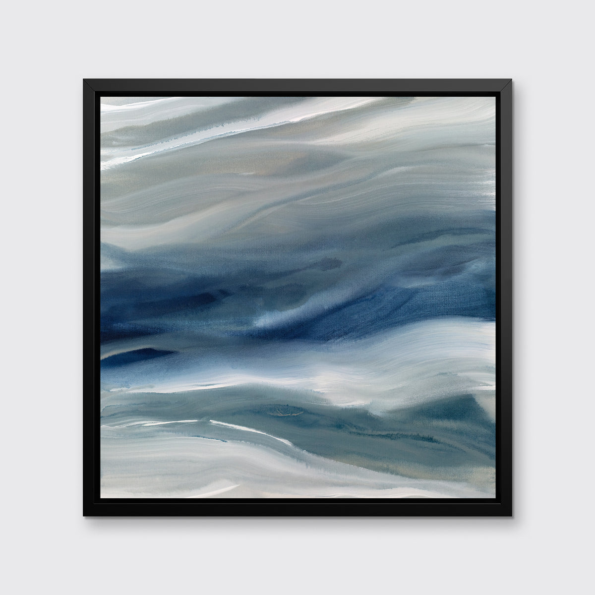 A blue, teal, beige and white abstract print in a black floater frame hangs on a white wall.