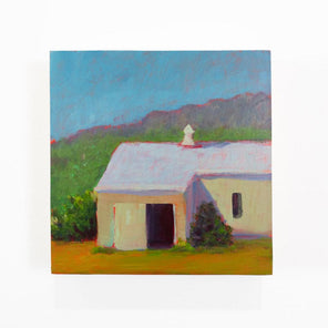 A small blue, green, and yellow landscape painting hangs on a white wall.