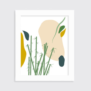 An abstract yellow, beige, blue, and green botanical art print in an unmatted white frame hangs on a white wall.