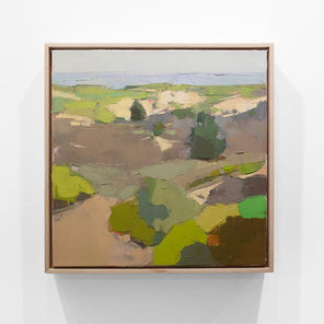 A small framed green and brown landscape painting hangs on a white wall.