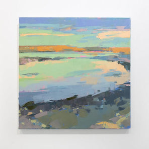 A pink, green, and blue abstract coastal landscape painting hangs on a white wall. 