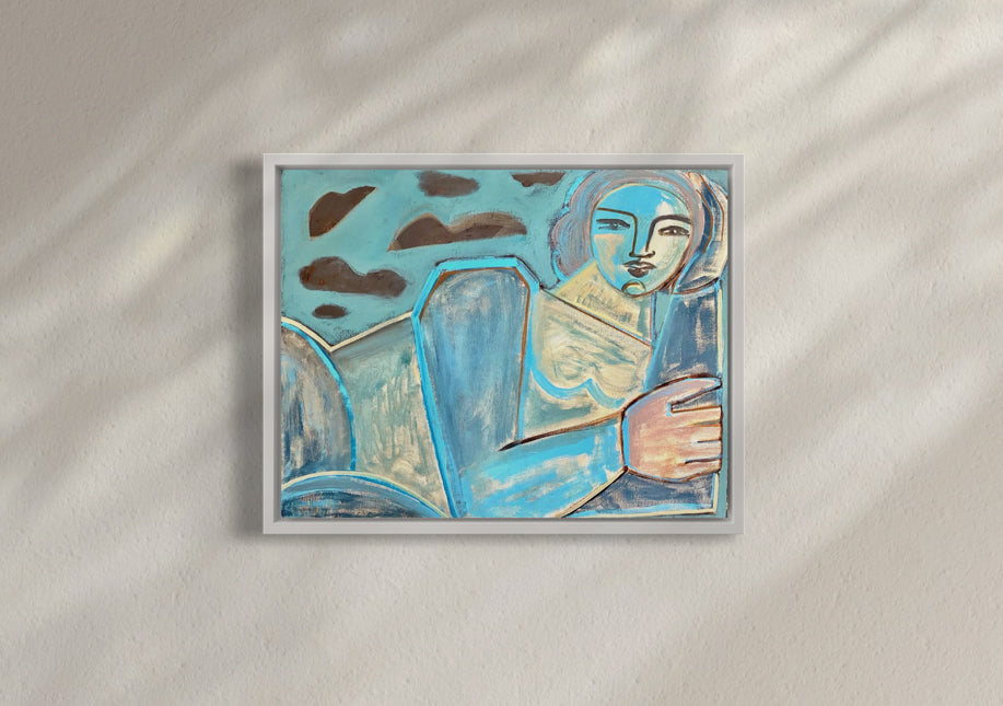 A blue, brown, and yellow painting of an abstracted woman framed in a white floater hanging on a wall.