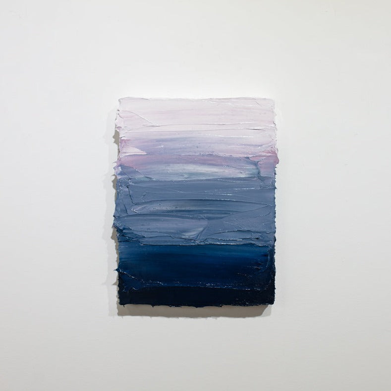 A blue, lavender and white textured painting on a white wall.