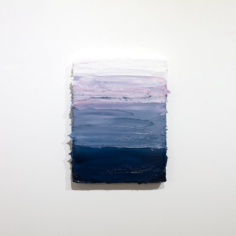 A blue, lavender and white textured painting on a white wall.