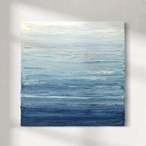 Abstract painting with horizontal brush strokes in blue and white on a gray background hanging on a white wall.