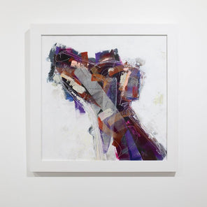 An abstracted painting of a dog framed in a white frame hangs on a white wall. 