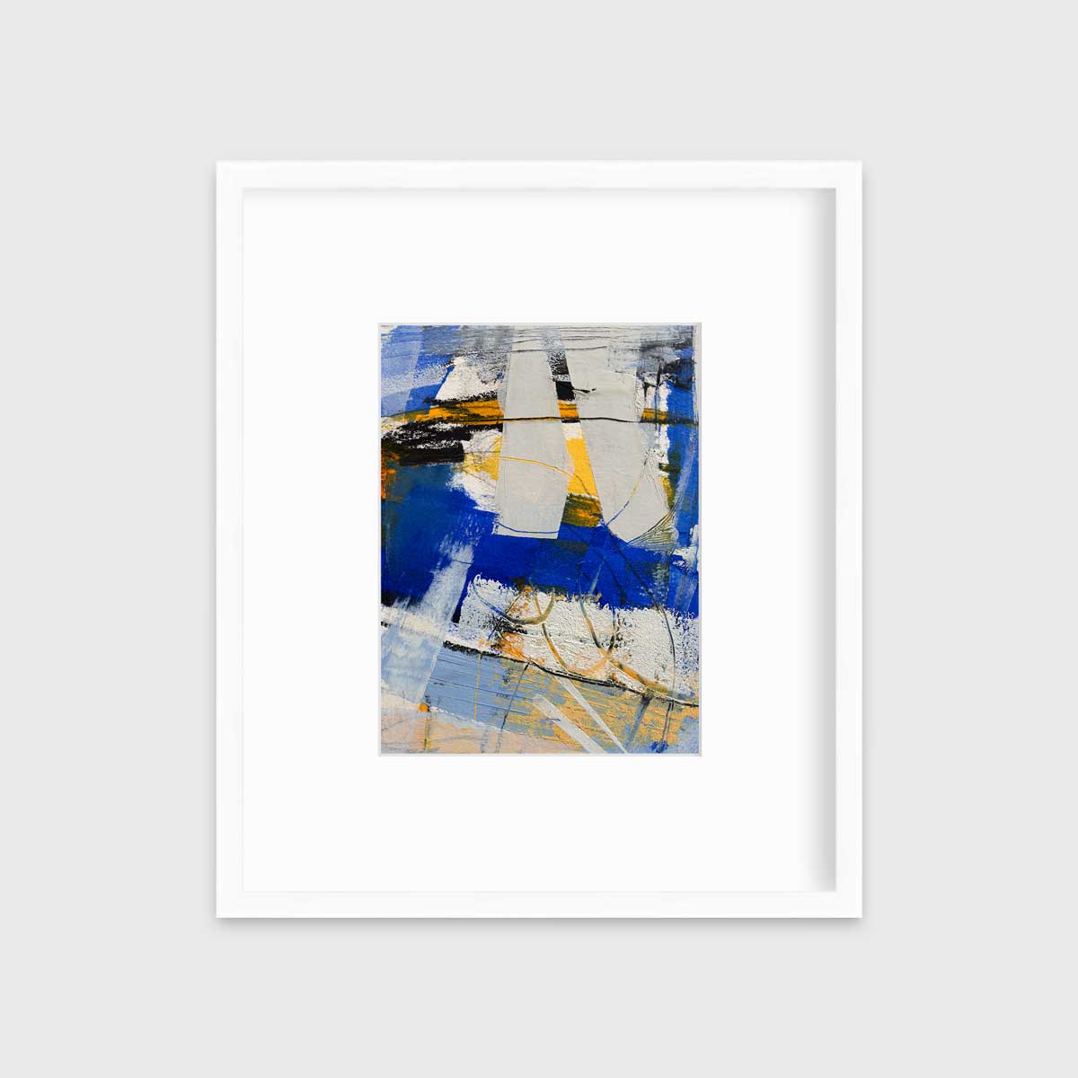 A blue, grey and yellow abstract print in a white frame with a mat hangs on a white wall.