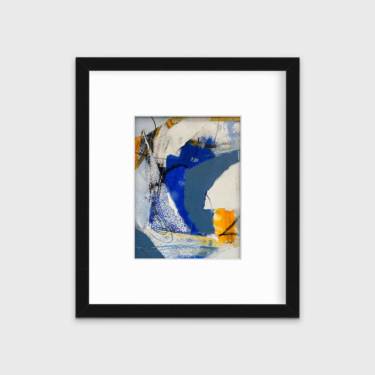 A blue, grey and yellow abstract print in a black frame with a mat hangs on a white wall.
