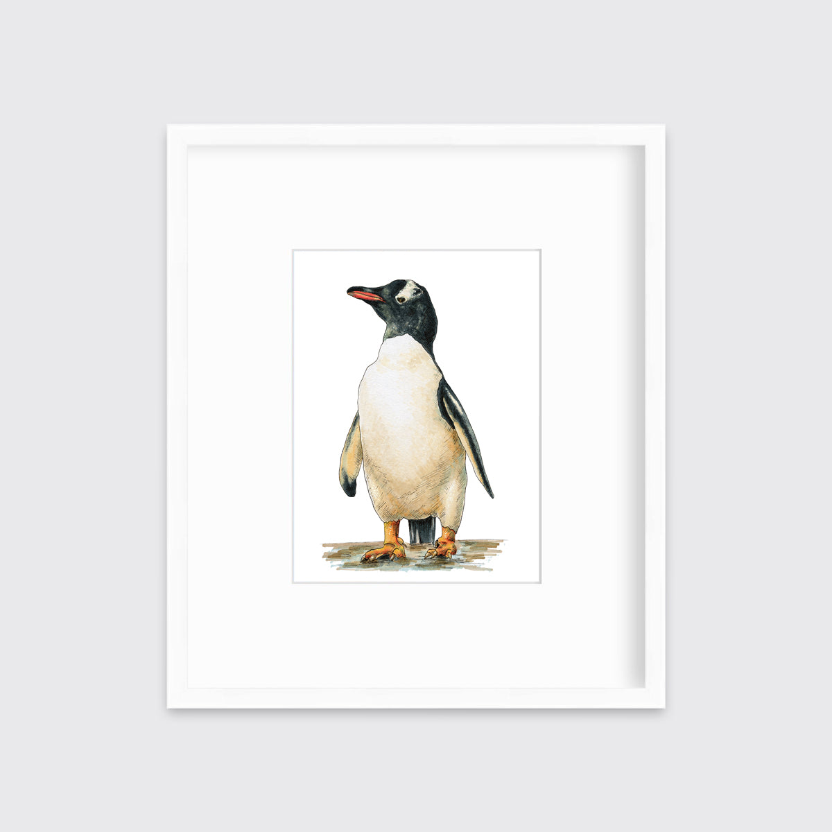 A penguin print in a white frame with a mat hangs on a white wall.