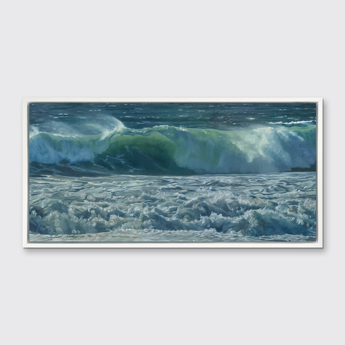 A painting of blue-green waves with white foam hangs in a white frame on a white wall.