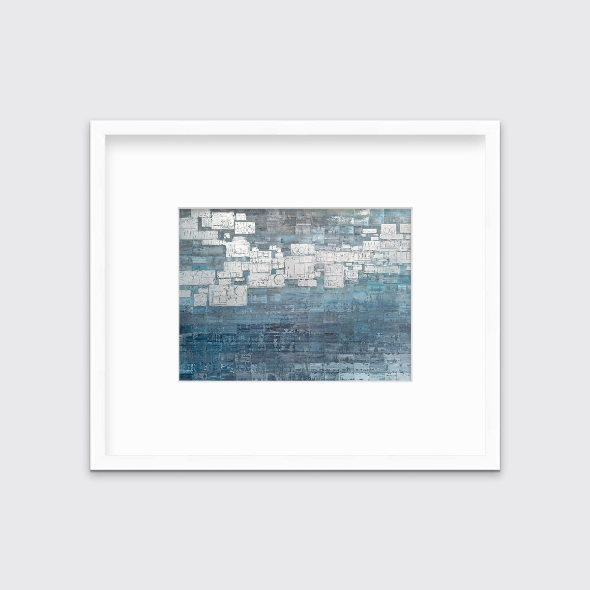 A blue, white and grey abstract print in a white frame with a mat hangs on a white wall.