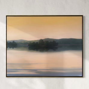 Framed artwork of a landscape with trees and water on a wall.