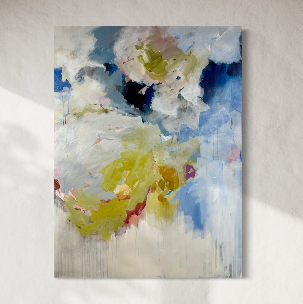 Abstract painting with colorful splashes on a light gray background