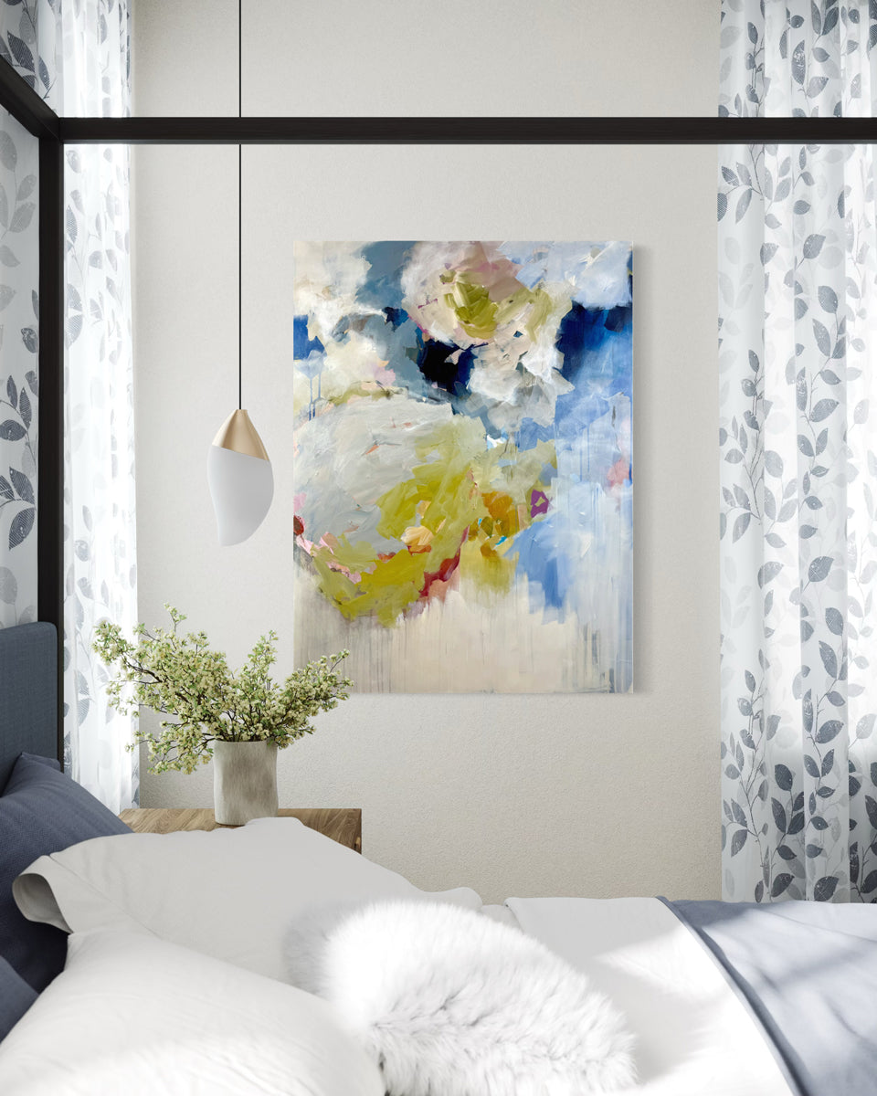 Decorative floral painting on a wall above a bed with light blue curtains.