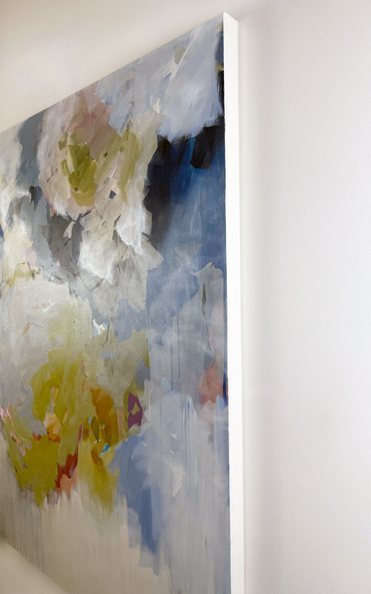 Abstract painting with watercolor textures on a white wall.