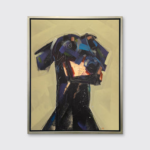 A black, dark purple, copper and chartreuse abstract dog print in a silver floater frame hangs on a white wall.