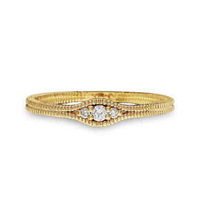 Gold ring with diamonds on a white background