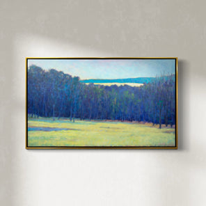 A blue, teal and chartreuse abstract landscape painting by Ken Elliott hangs in a gold faced frame on a white wall.