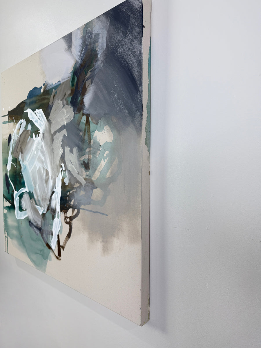Abstract painting with blue, green, and white colors on a white wall.