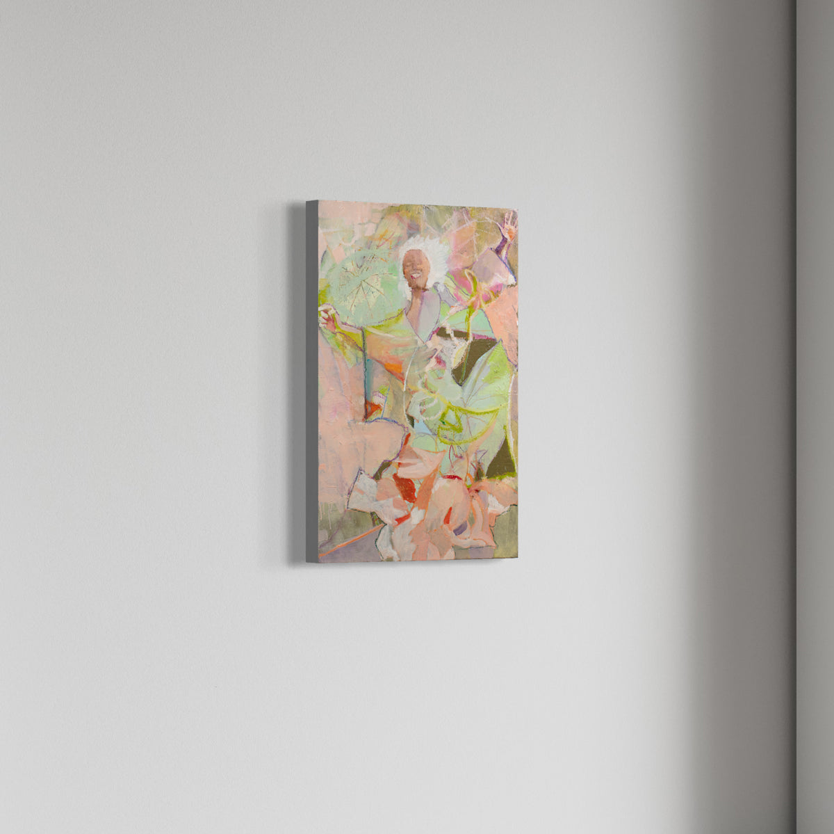 A pink abstracted figure painting hangs on a white wall. 