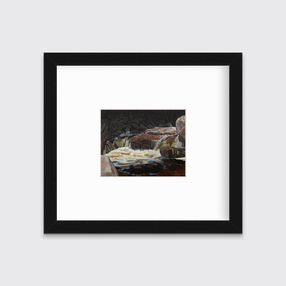 A brown, black and white abstract river landscape print in a black frame with a mat hangs on a white wall.