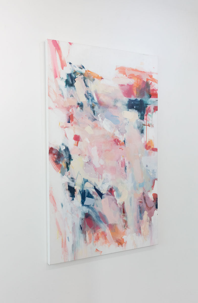 A light pink and white abstract painting by Kelly Rossetti with dark blue and red accents is seen at an angle on a gallery wall.