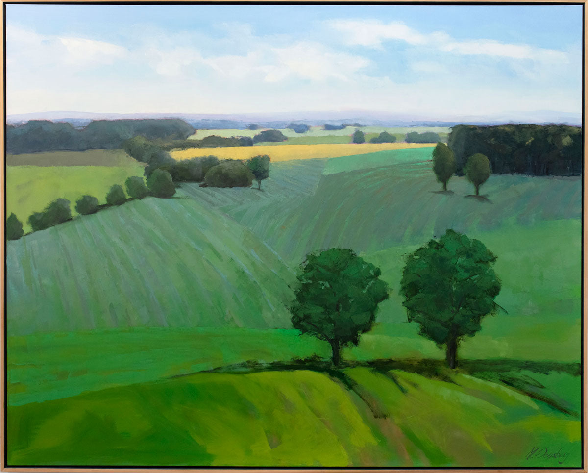 A green landscape painting with a light wood floater frame. 