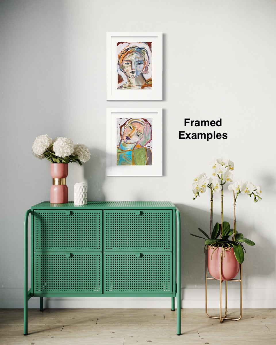Green cabinet with framed artwork on a gray wall