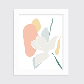 A light abstract botanical art print in an unmatted white frame hangs on a white wall.