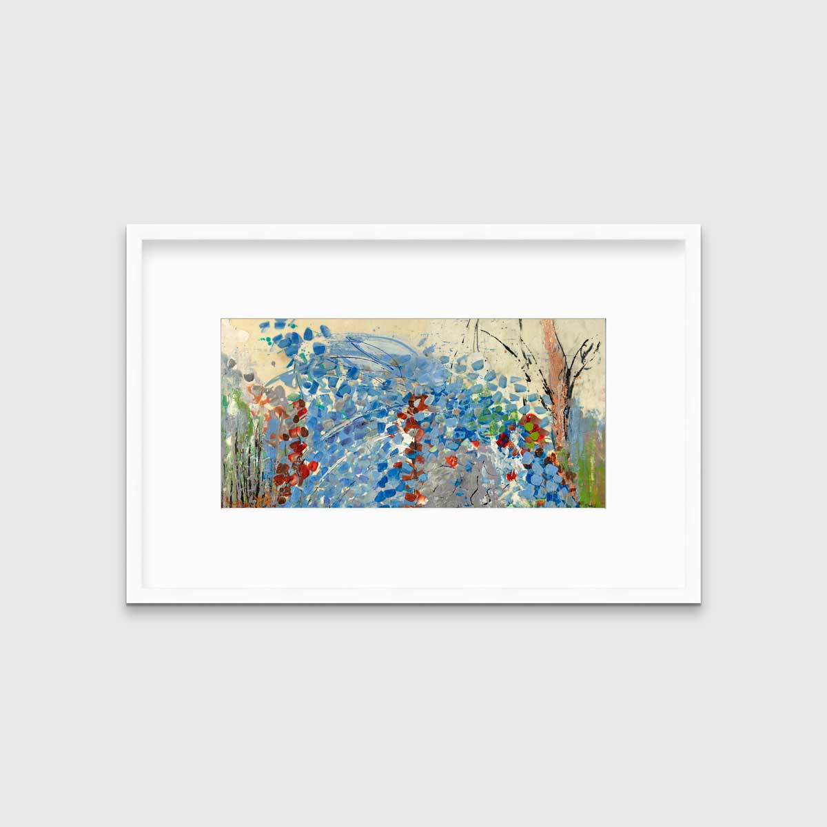 A blue, beige, green and black abstract print in a white frame with a mat hangs on a white wall.