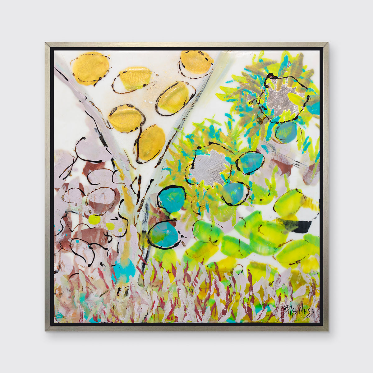 A yellow, green and red abstract floral print in a silver floater frame hangs on a white wall.