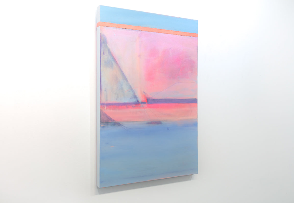 A pink and blue abstract painting hangs on a white wall.