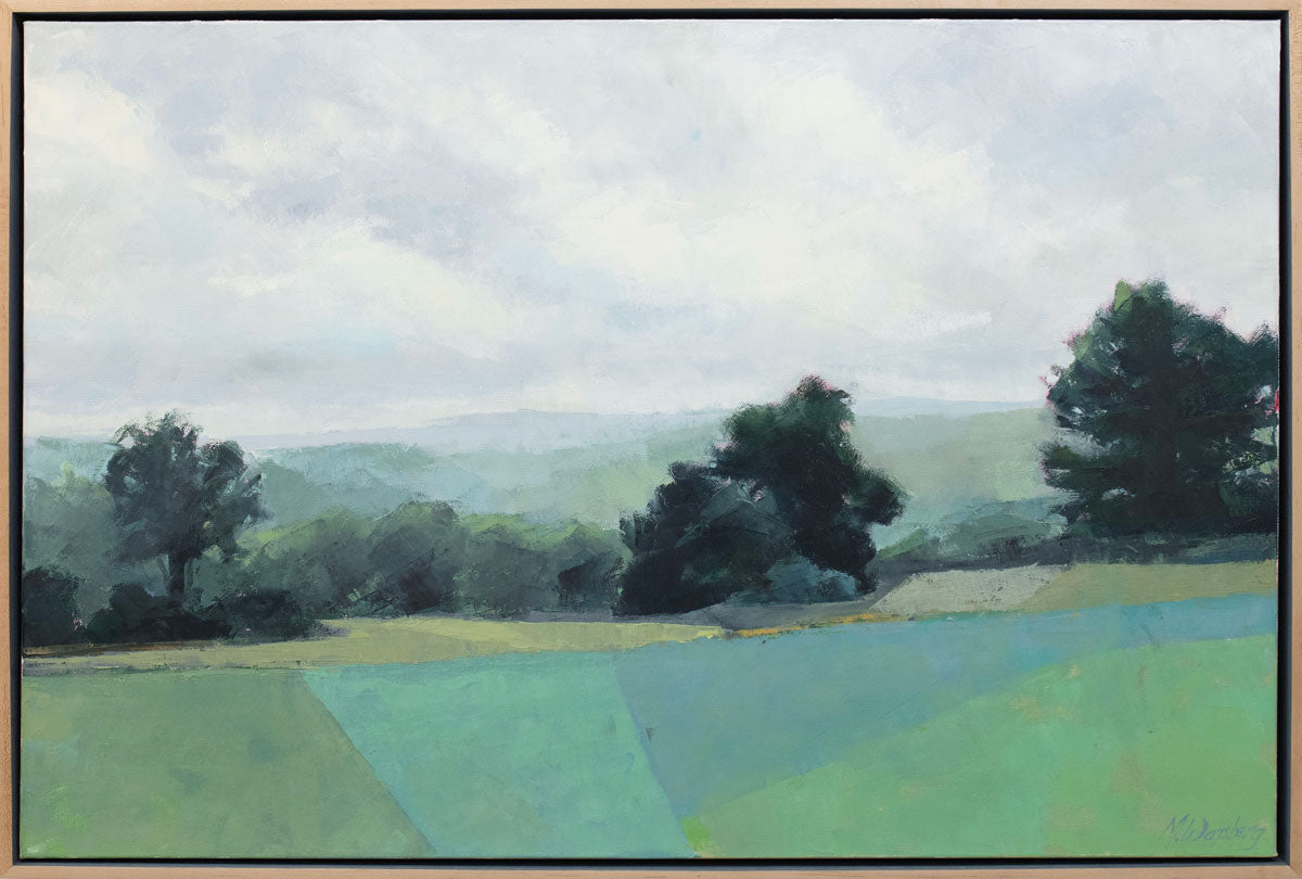 A green landscape painting framed in a light wood frame.
