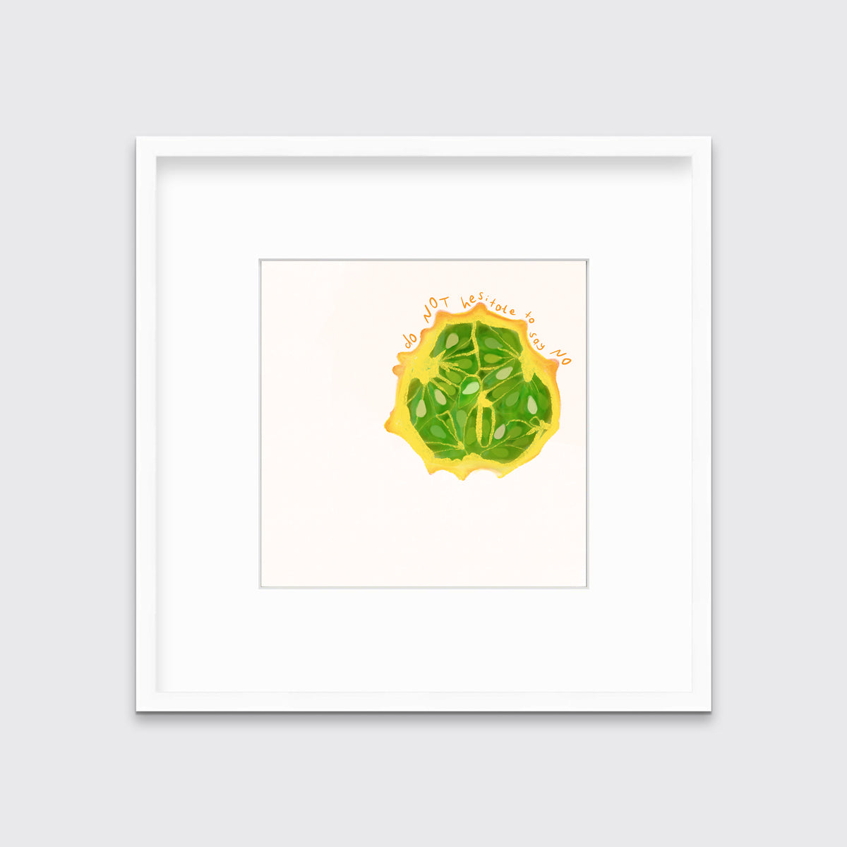 An art print of a fruit with the words "do not hesitate to say no" in a white frame with a frame hangs on a wall.