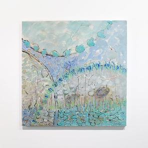 A blue and turquoise abstract painting hangs on a white wall. 