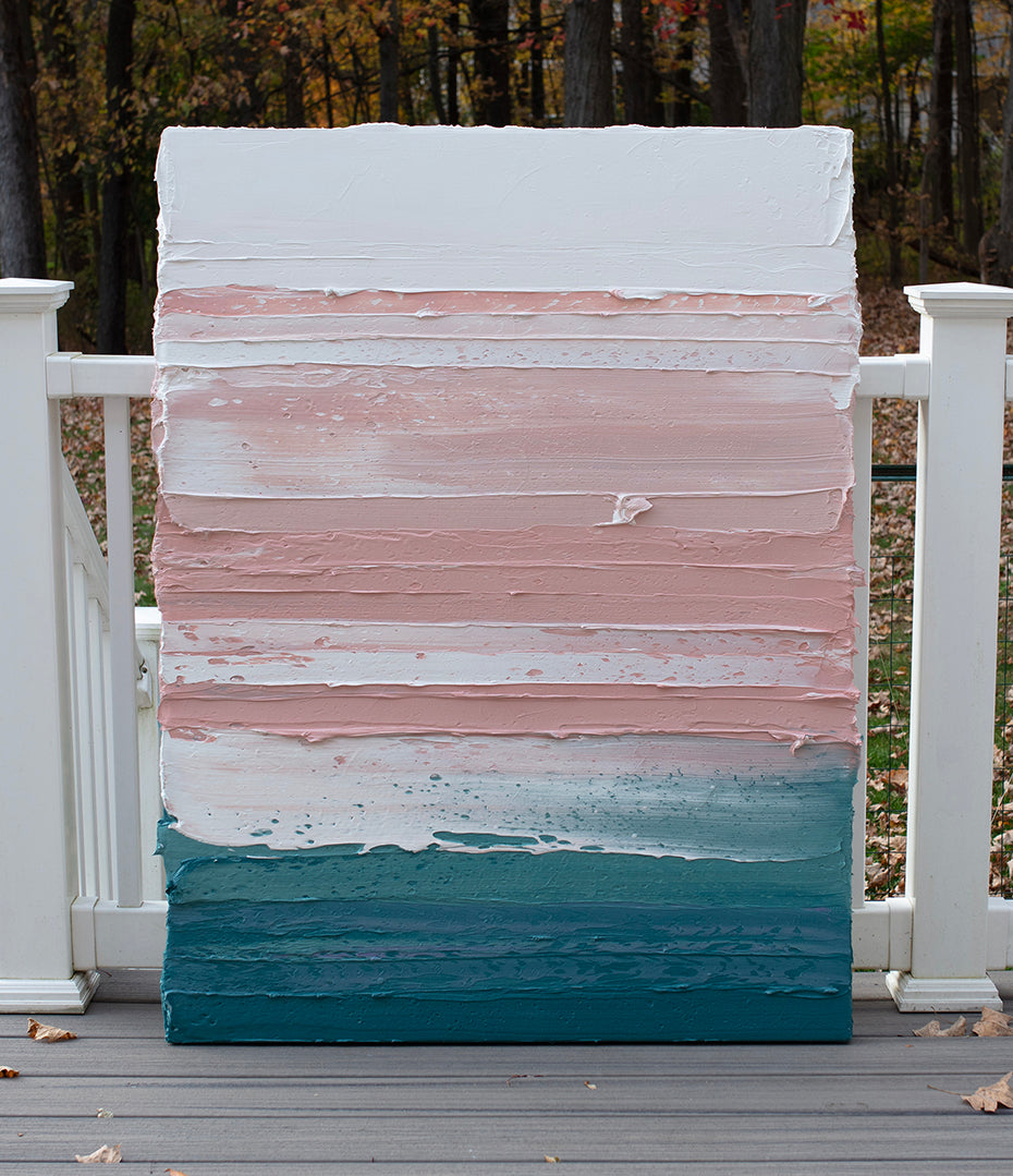 A peach, coral, white and teal with lavender thick textured painting leaning outside on a deck in natural light by Teodora Guererra.