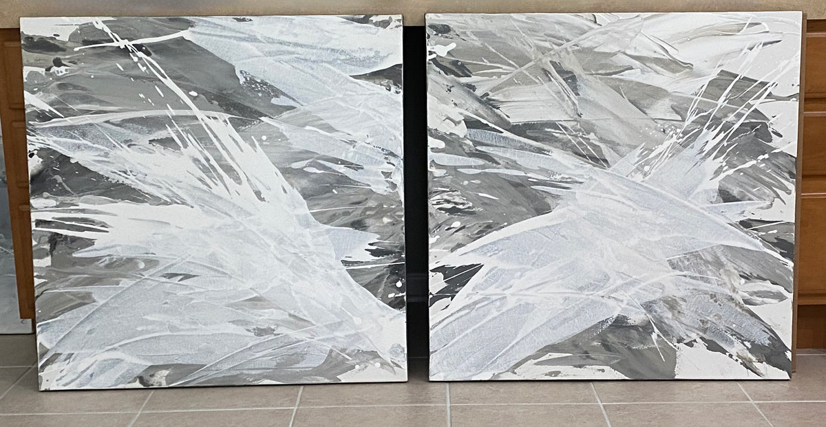 Two abstract paintings in the artists studio.