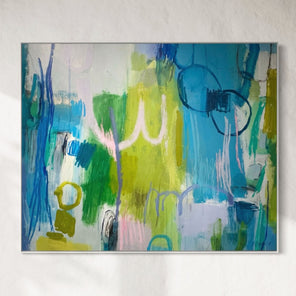 Abstract painting with vibrant colors on a white wall