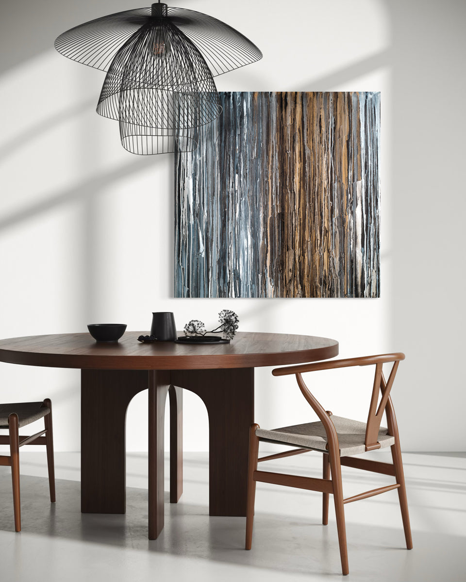 Dining room with wooden table and chairs, with an original abstract painting on the wall.
