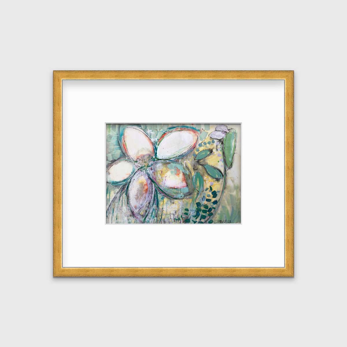 An abstract floral print in a gold frame with a mat hangs on a white wall.