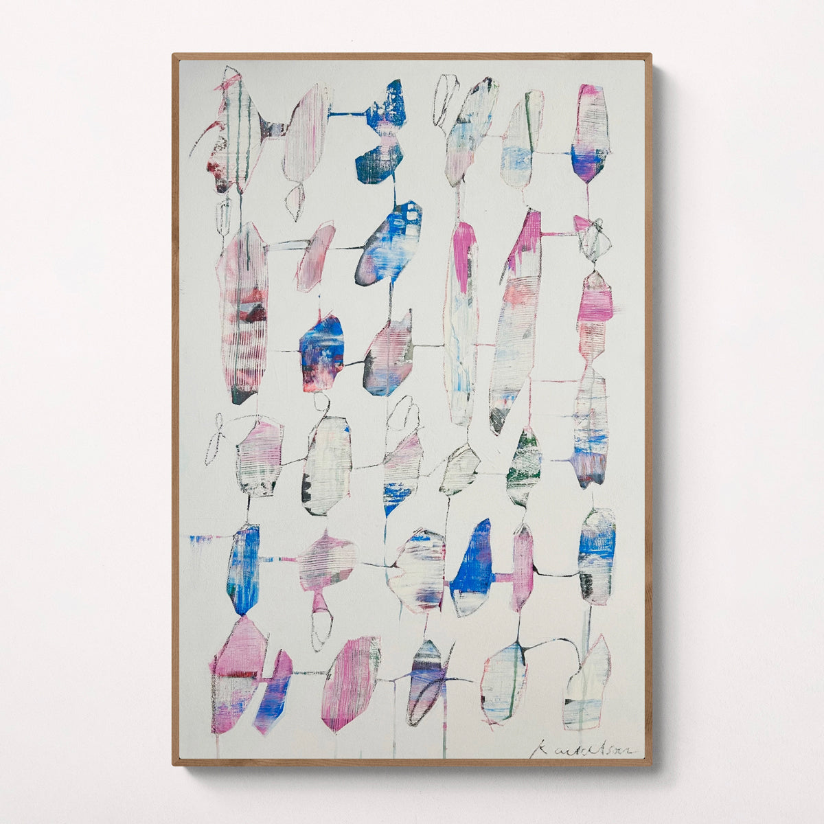 Framed abstract artwork with colorful geometric shapes on a light background.