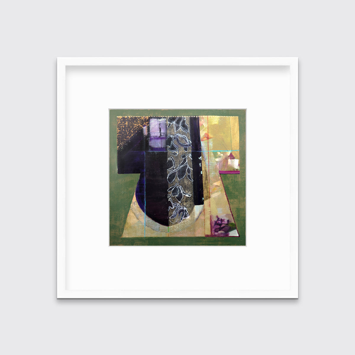 A green, gold and black abstract print in a white frame with a mat hangs on a white wall.