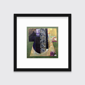 A green, gold and black abstract print in a black frame with a mat hangs on a white wall.