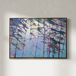 An impressionistic landscape painting by Ken Elliott in the of trees with blue and purple leaves in a gold floater frame hangs on a white wall similar to the spirit of the late artist Wolf Kahn, hangs on a white wall.