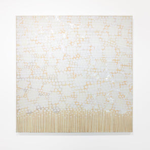 A white and sandy-beige abstract painting by Sofie Swann hangs on a white wall. 