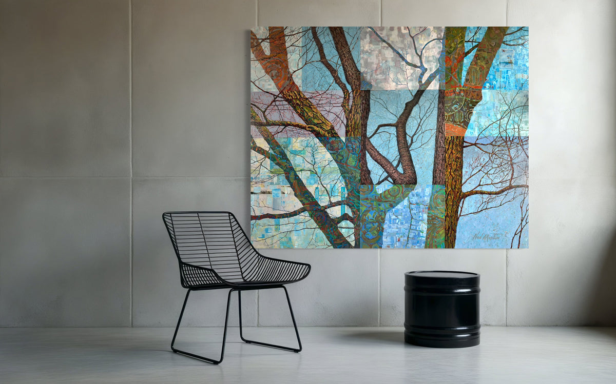 Abstract tree painting on a wall with a black wire chair and black cylindrical object below.