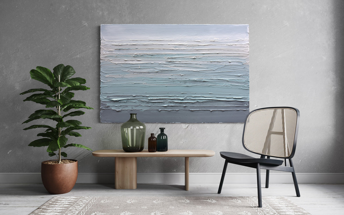 Modern interior with a original abstract painting buy Teo Guererra, table, chairs, and plants.